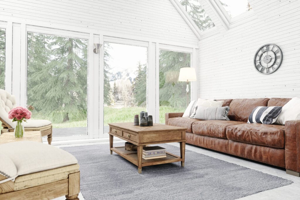 Living room of a chalet with forest and mountain view.