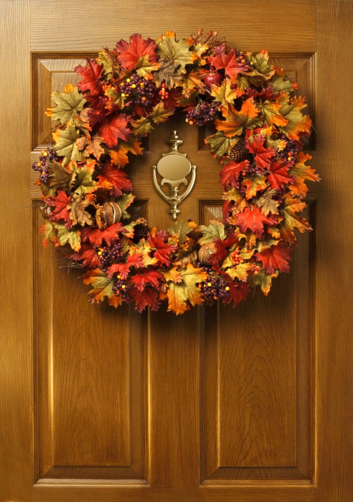 A fall wreath hanging on a door.To see more of my Thanksgiving images click on link below: