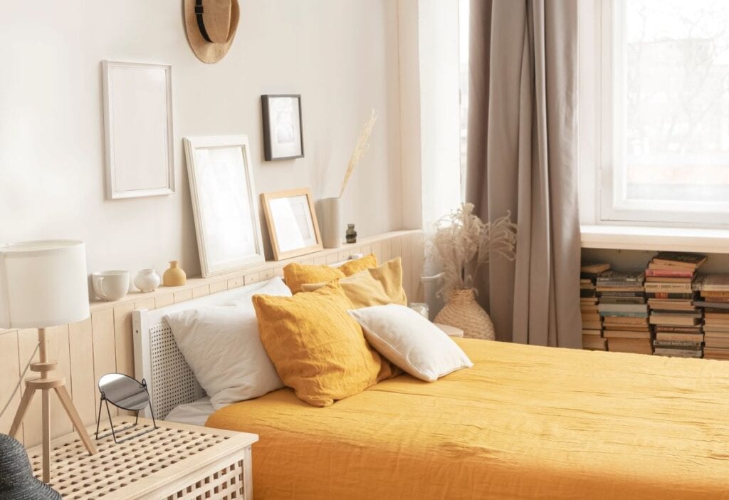 Bedroom with gray, taupe, and yellow colors