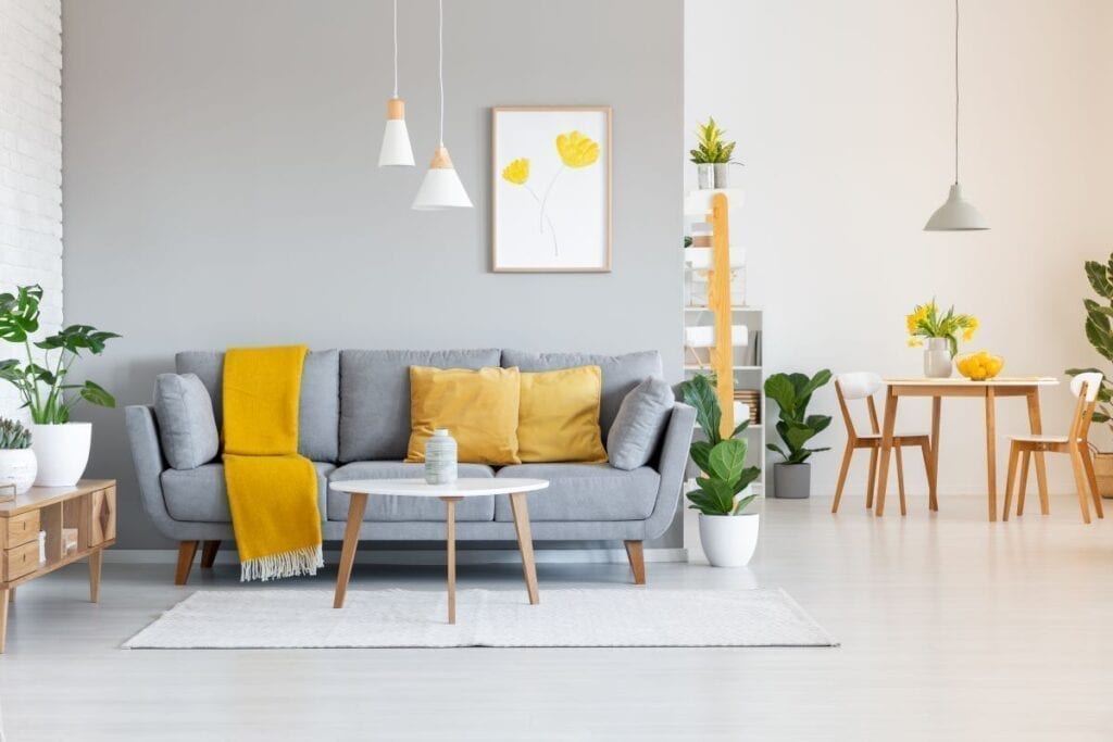 Gray and white living room with mustard yellow accents