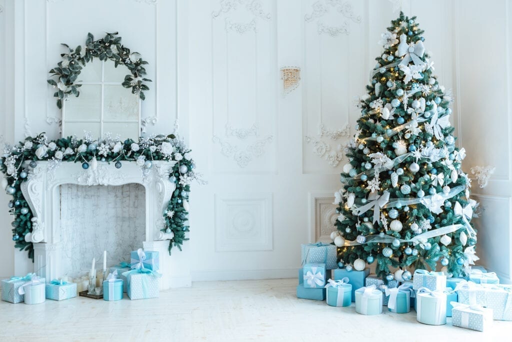 Christmas tree and living room decorated in blue accents