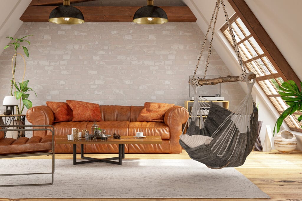 Loft room with leather couch and hammock
