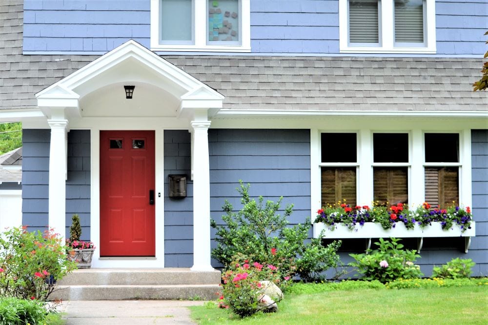 Red front door with blue house