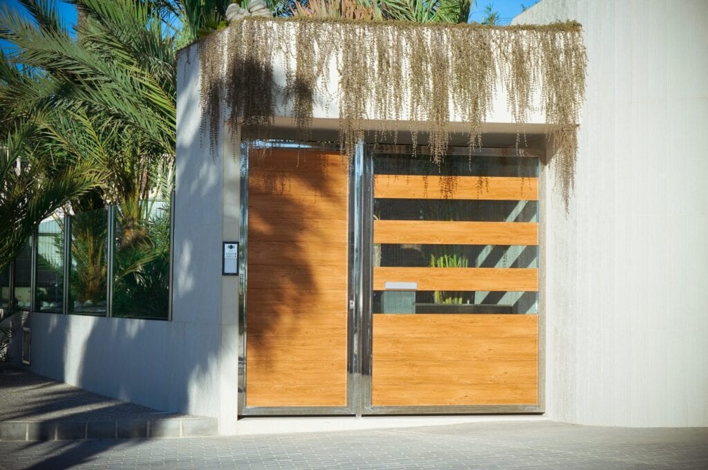 Big wooden and crystal entrance door of a big modern house