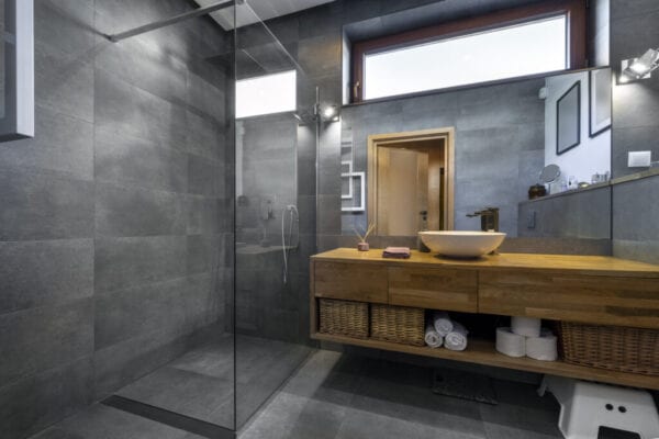 Modern interior design - bathroom in gray and wooden finishing