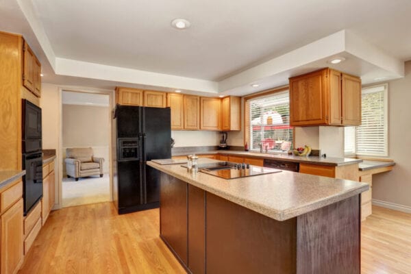 Kitchen room interior with with granite counter top and island.