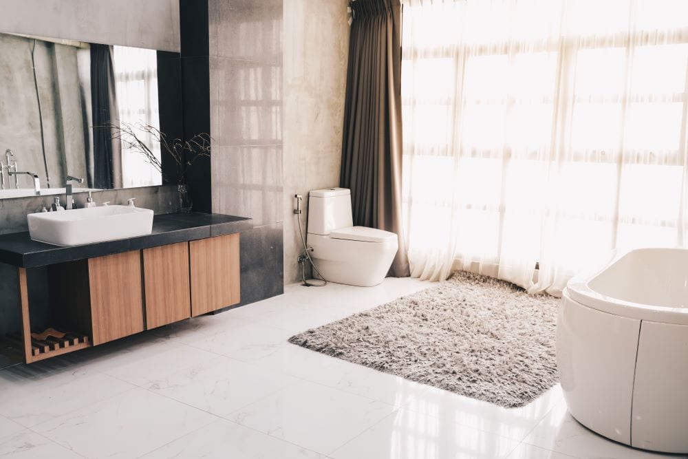 Modern luxury bathroom interior with soft curtains and natural light