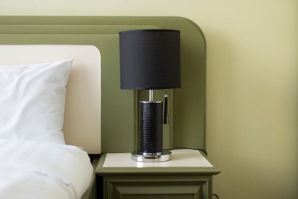 Bedroom with matching green headboard and nightstand