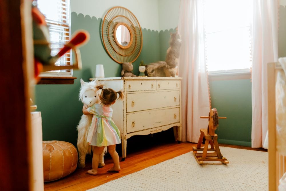 Young girl's bedroom with sage green walls