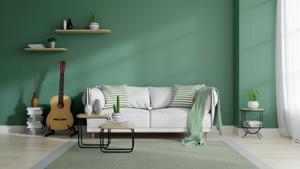 white couch with green patterned accents 