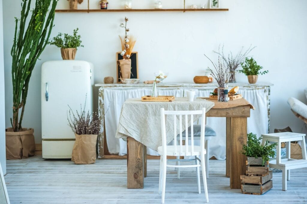 Vintage style kitchen filled with indoor plants