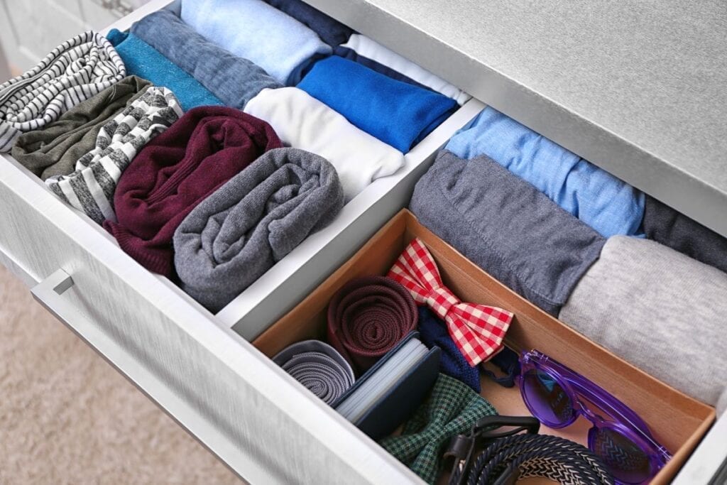 Men's clothes stored in dresser drawer