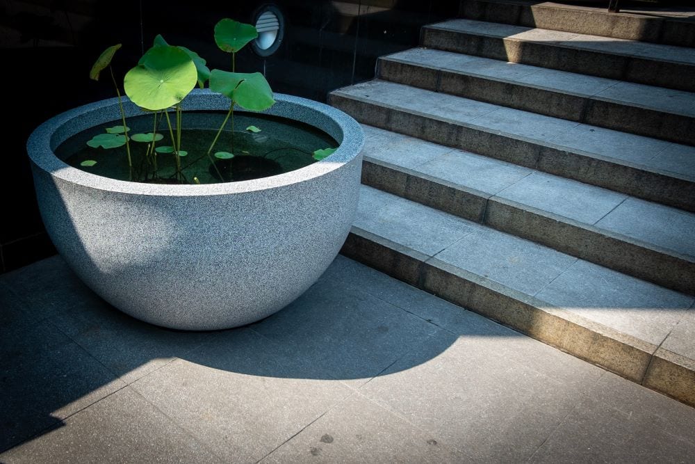 Ceramic pot with plants, garden water feature