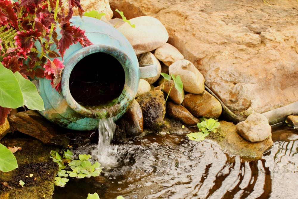 Garden waterfall created with ceramic vase