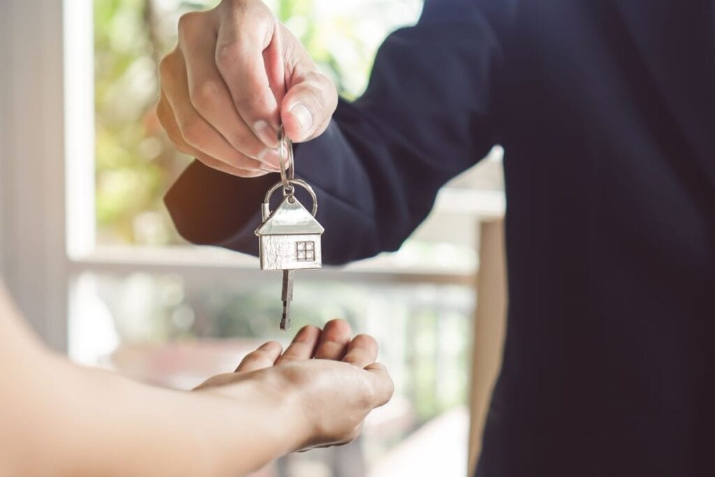 Landlord handing keys to tenant