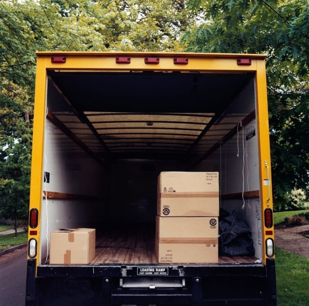 Boxes inside moving truck, packing open moving truck