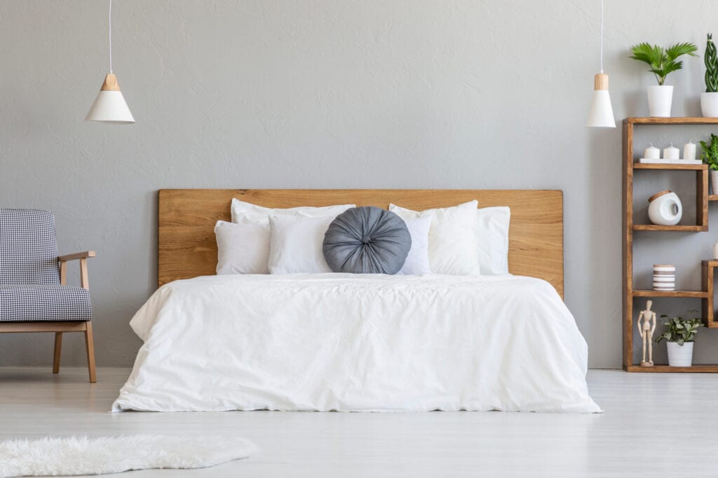 bed with wood headboard