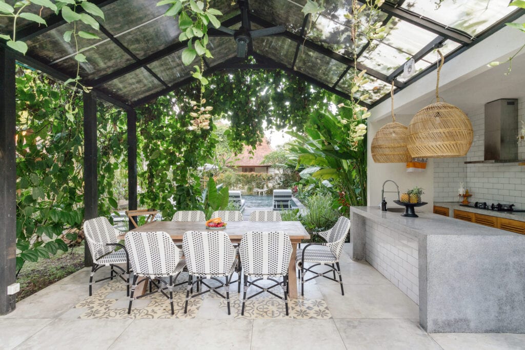 Outdoor dining space with greenery