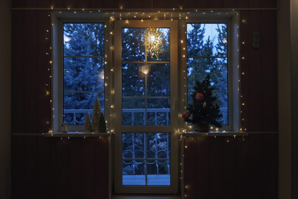 Christmas tree and string light at the window