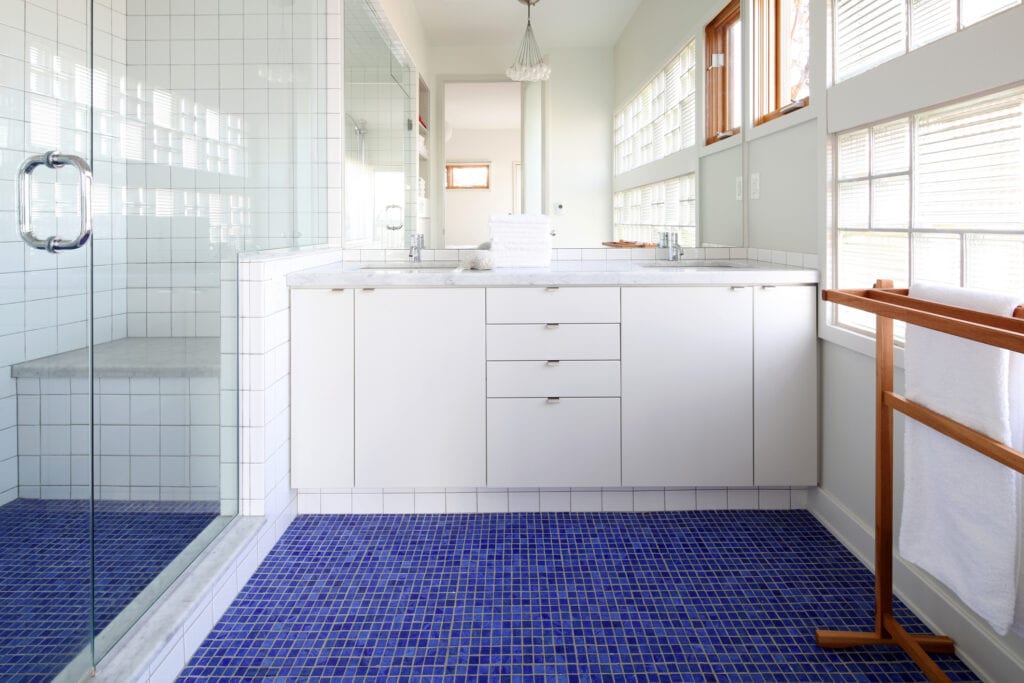 Bathroom with blue tiled floor