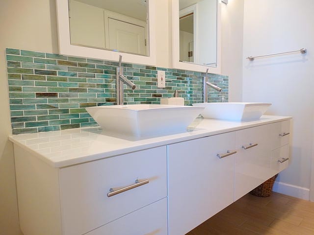 Teal tiled bathroom