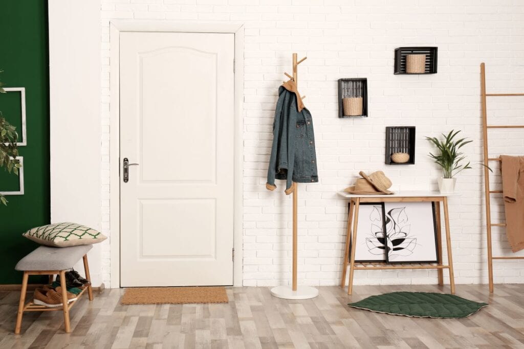 Foyer and mudroom area with pops of green color