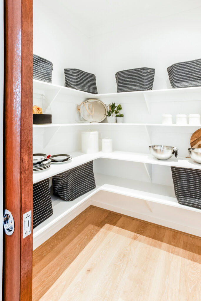 Chic décor for living room, two high sofa chairs with a table, attached to the kitchen.