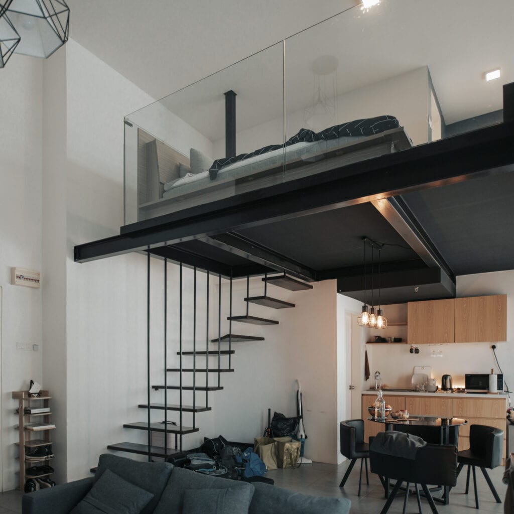 living room and kitchen of apartment with sofa and coffee table