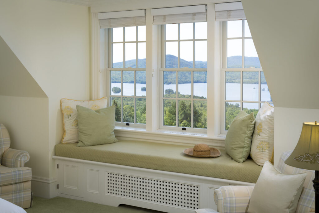 Bedroom with window seat and view, Moosehead Lake Area, Greenville, Maine, USA.