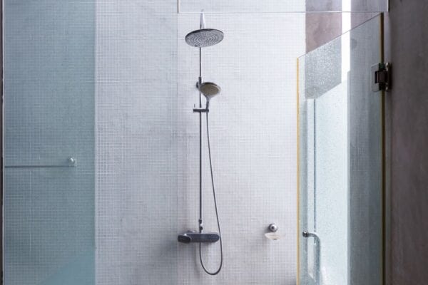 Private outdoor shower with tile and glass walls