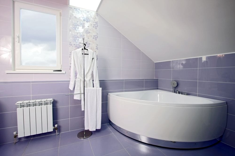 Bathroom with lilac tiles on wall and floor