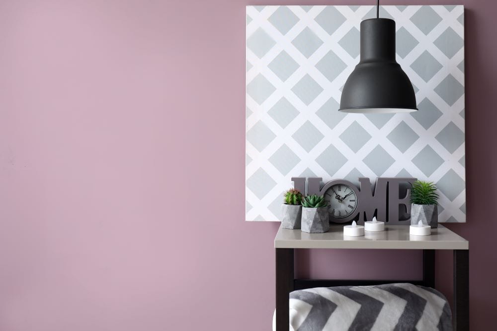 Home decor, lilac wall with black and white table decor