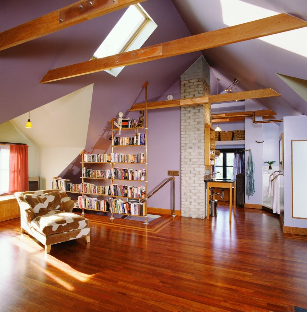 Rustic style room with bookshelves and lilac walls