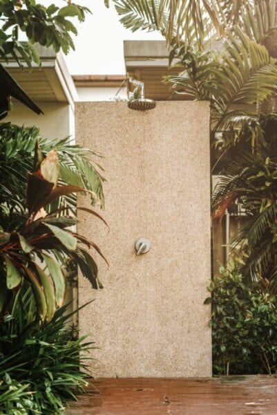 Luxury outdoor shower surrounded by plants