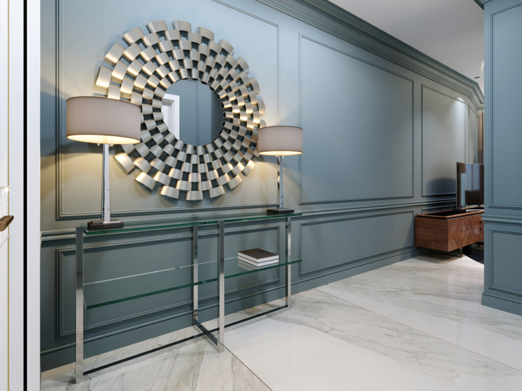 Hallway of modern blue foyer with mirror and lamps