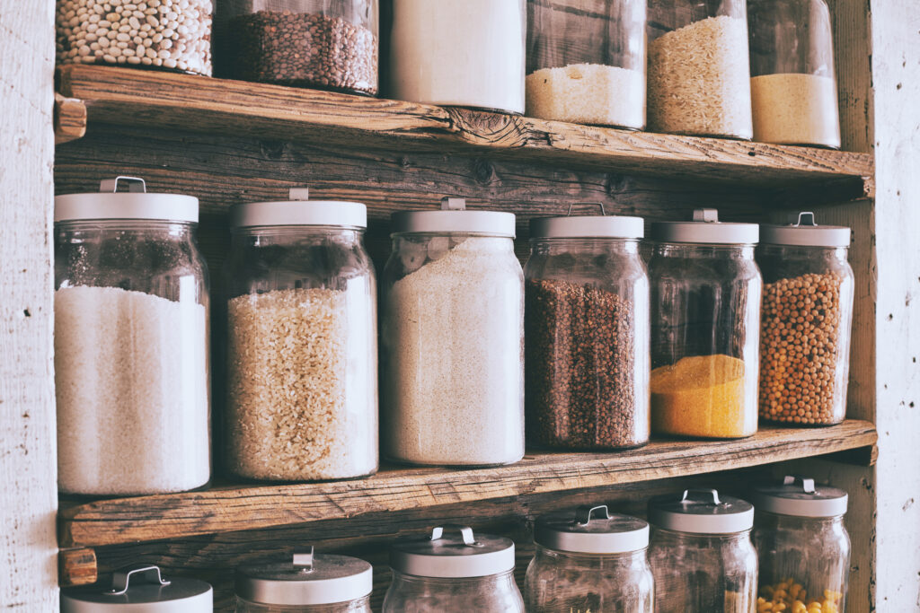 Jars of ingredients on wooden shelves