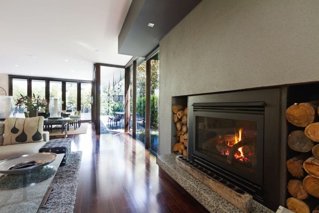 Industrial style metal fireplace in wide open living room