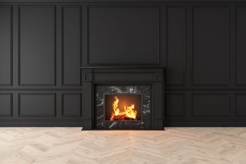 Fireplace surrounded by black marble and black wood