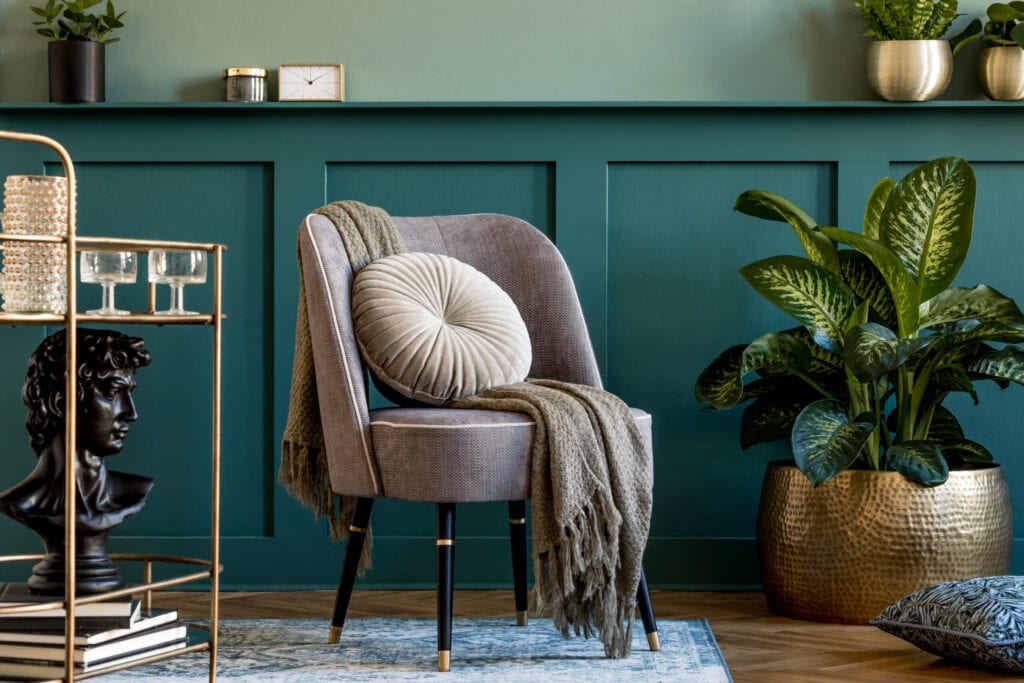 Interior design of living room with stylish armchair. Wood paneling. Modern home staging. Template.