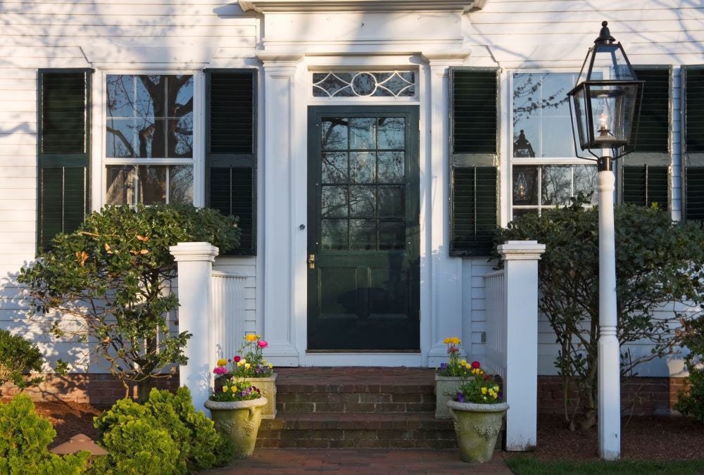 Close up photo of entry way of Cape Cod-style house