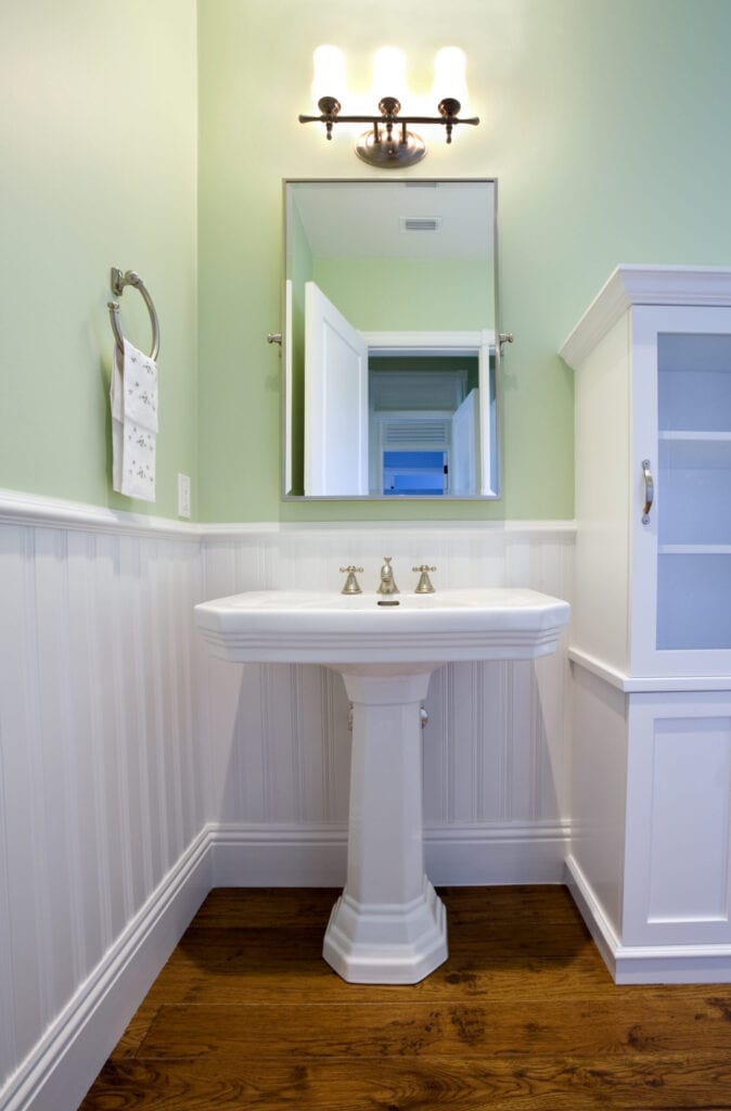 Pedestal sink in a bathroom.