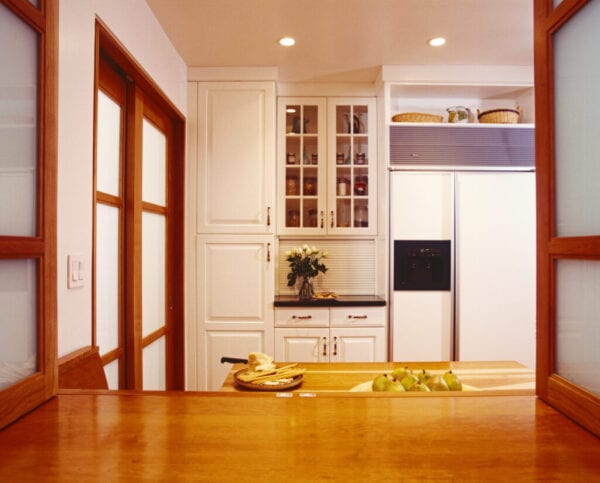 Kitchen with White Cabinetry and Wood Trim