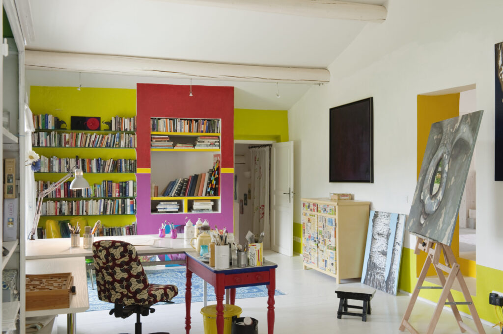 floor atelier with plan table and office chair upholstered in Kenyan printed cloth