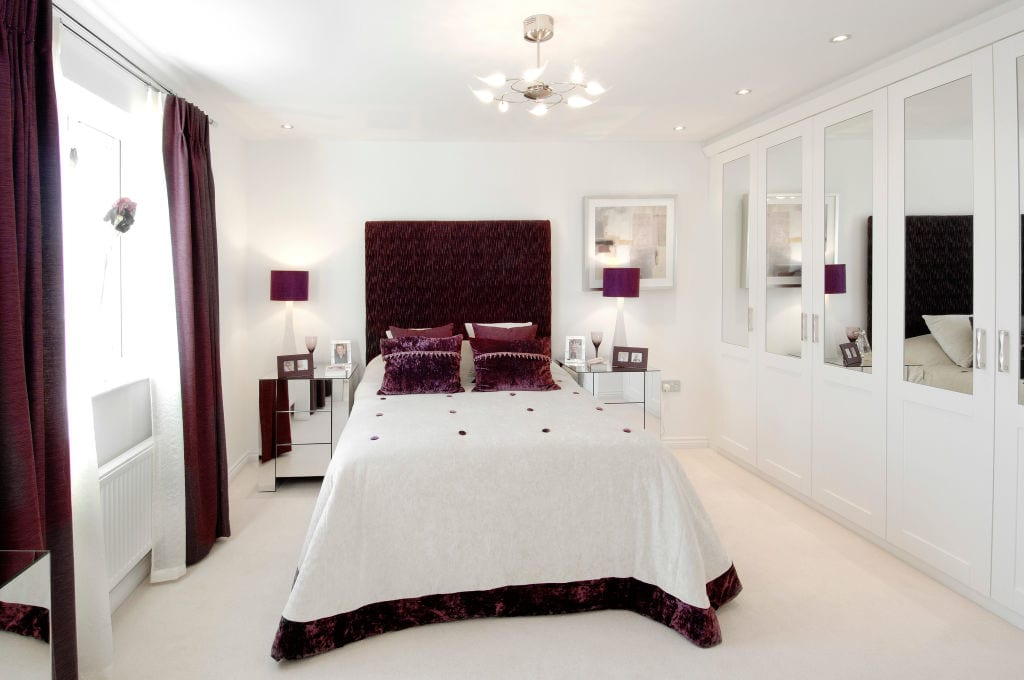 Luxury bedroom with purple comforter