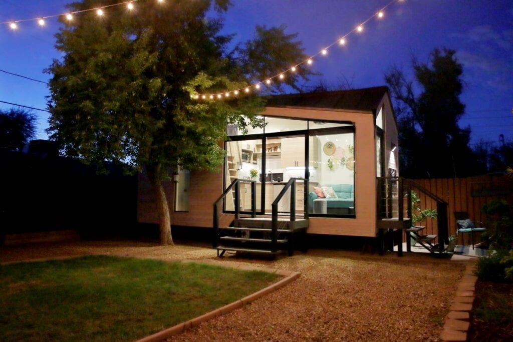 Tiny house with living room visible through windows