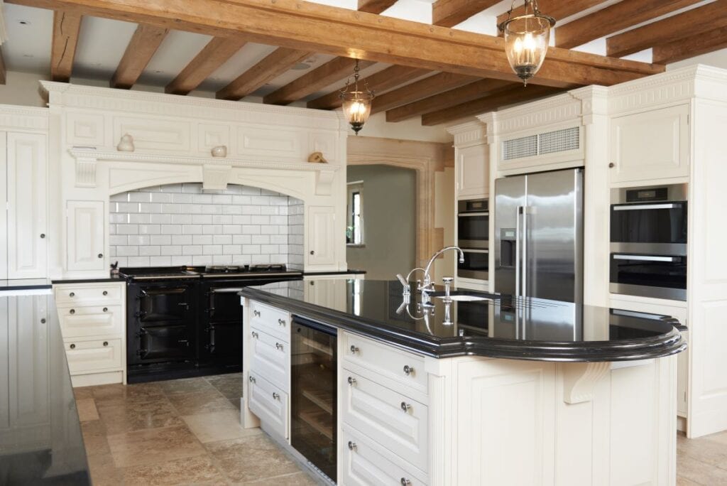 Luxury modern farmhouse kitchen with wine fridge built into island