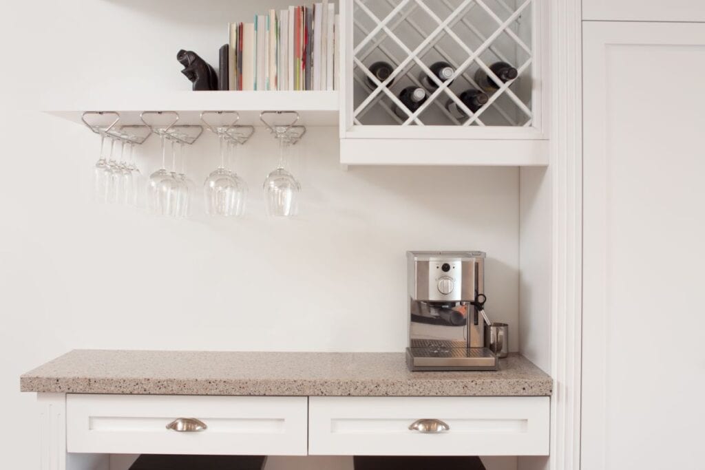 Kitchen with minimalist built in wine shelves