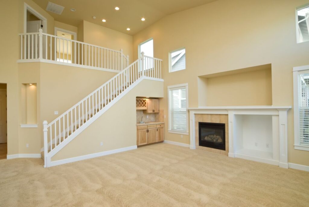 Wet bar wine room built into stairs in unfurnished house