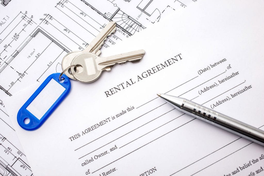 A rental agreement with keys on top