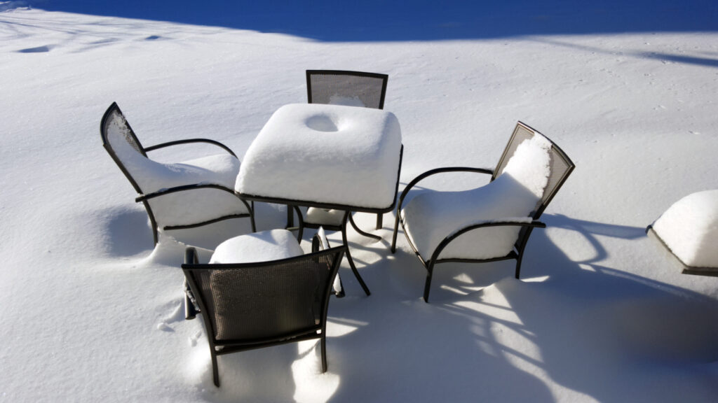 snow-covered patio furniture